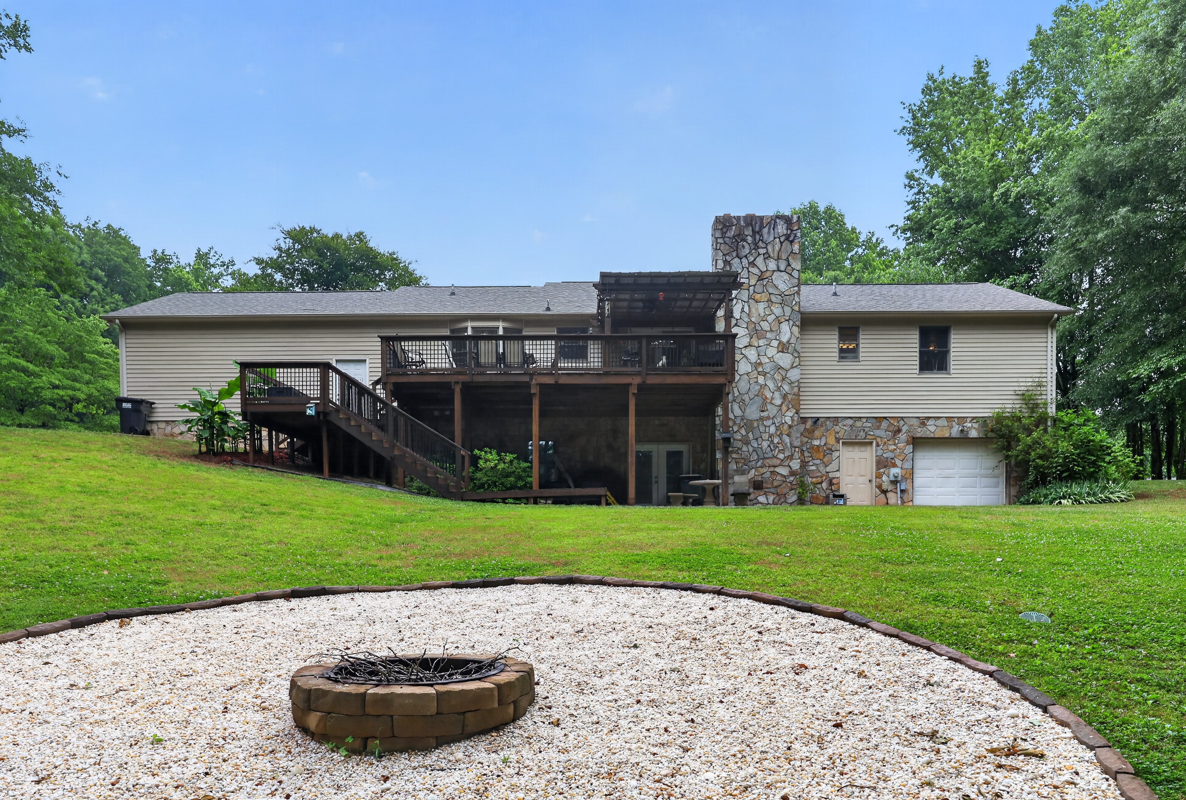 Rear exterior with stone chimney