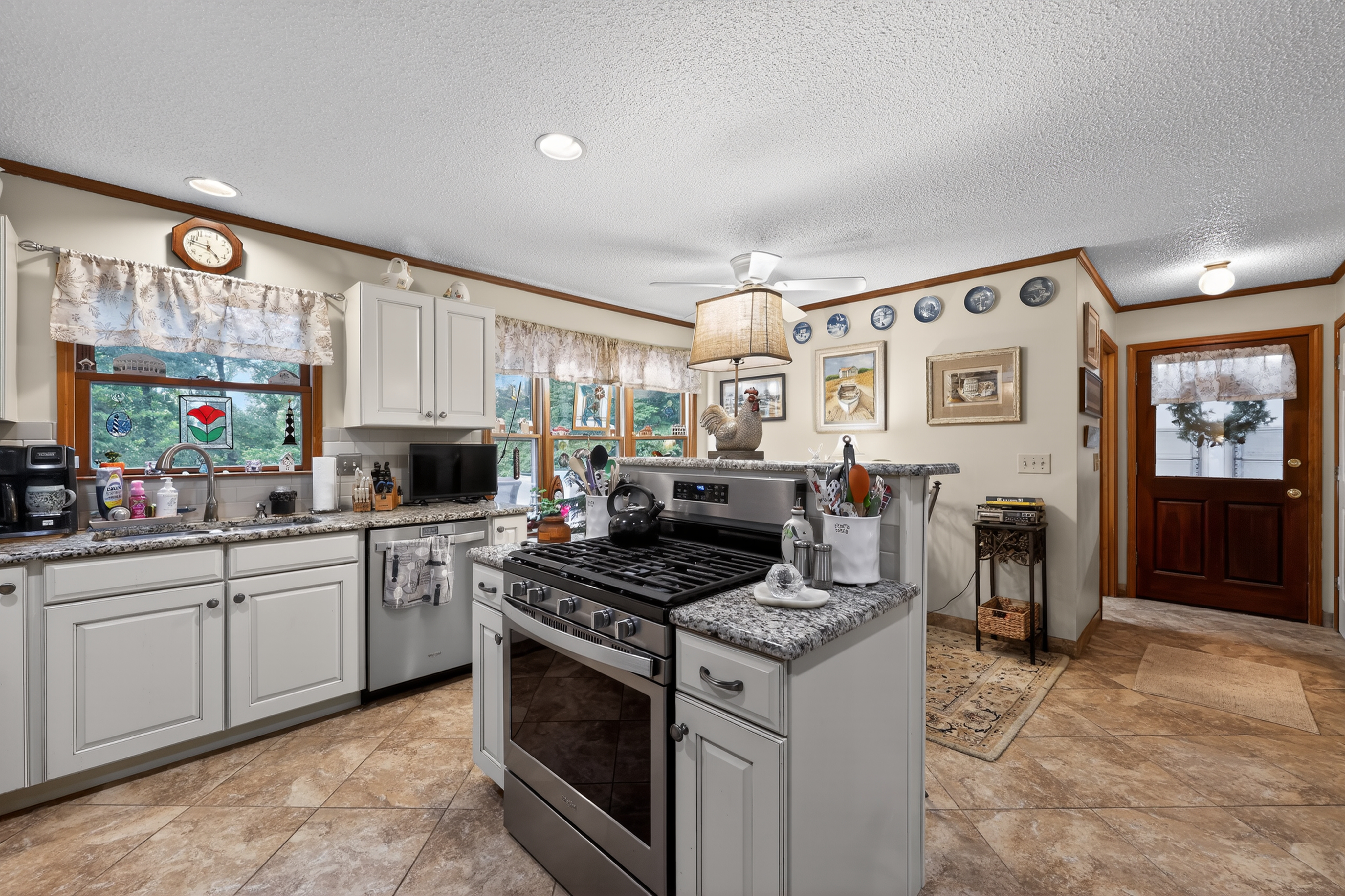 Kitchen with island and gas range