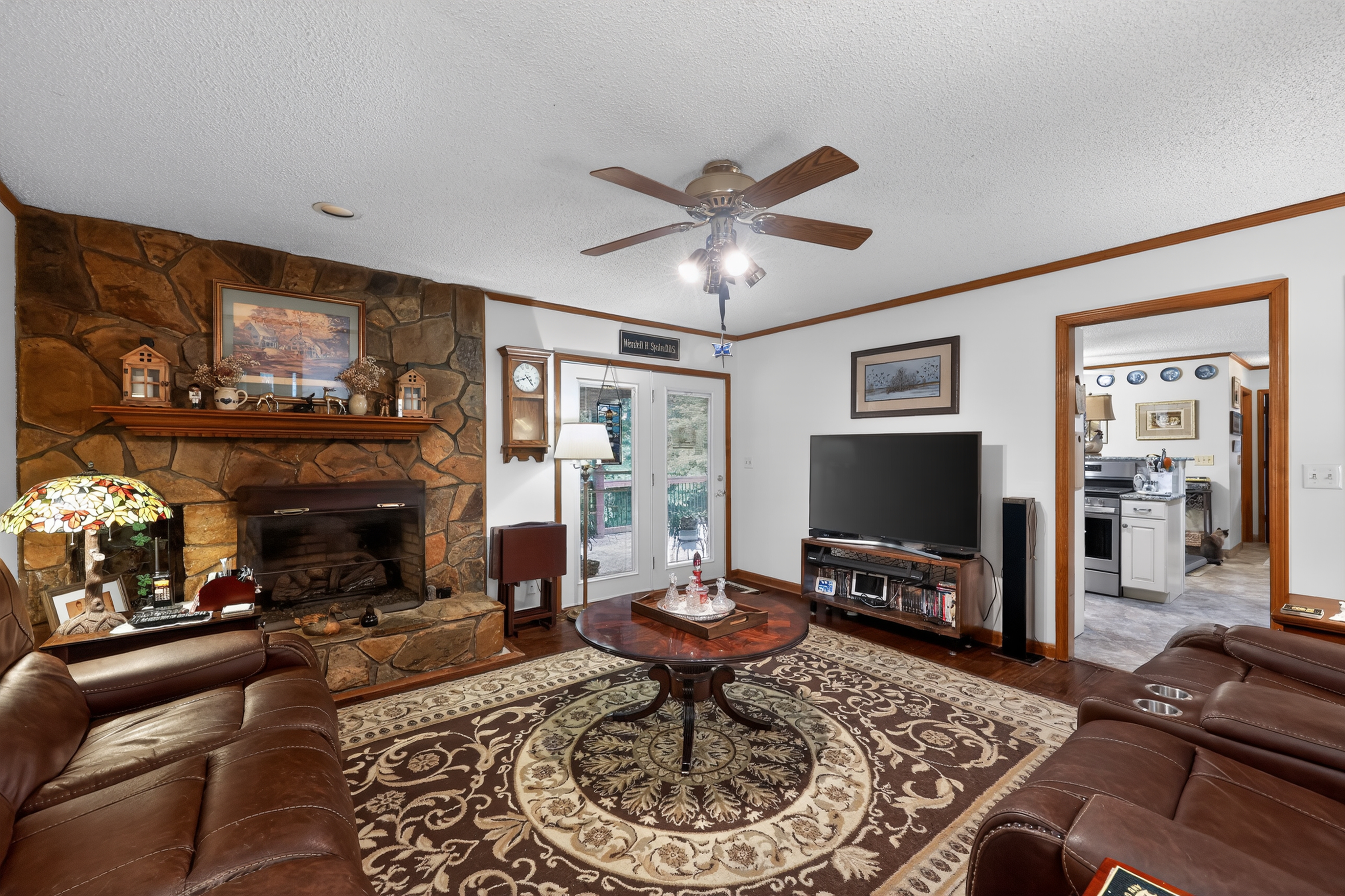 Living room with stone fireplace
